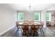 Dining area with hardwood floors, a wooden table, and large windows offering ample natural light at 856 Skyline Dr, Chester, SC 29706