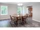 Dining area with hardwood floors, a wooden table, and large windows offering ample natural light at 856 Skyline Dr, Chester, SC 29706
