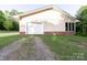 Attached garage with white door and adjacent windows, offering convenient parking and storage at 856 Skyline Dr, Chester, SC 29706