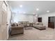 Inviting living room with a doorway, shelving, carpet, and comfortable seating arrangements at 856 Skyline Dr, Chester, SC 29706