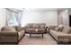 Comfortable living room featuring upholstered sofas, a coffee table, and soft carpeting at 856 Skyline Dr, Chester, SC 29706