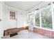 Sunroom with brick base, large windows, two exterior doors, and backyard foliage view at 856 Skyline Dr, Chester, SC 29706
