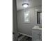 Neutral bathroom with modern vanity and window with natural light at 874 Old Home Place Way, Lincolnton, NC 28092