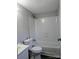 Neutral bathroom featuring a tiled shower-tub and modern fixtures at 874 Old Home Place Way, Lincolnton, NC 28092