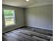 Bedroom showcasing stylish laminate flooring and natural light at 874 Old Home Place Way, Lincolnton, NC 28092