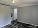 Bedroom featuring stylish laminate flooring and neutral walls at 874 Old Home Place Way, Lincolnton, NC 28092
