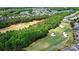 Stunning aerial view of a golf course community with lush green fairways and beautiful homes at 9003 Smokey Hill Ln, Fort Mill, SC 29707
