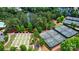 Aerial view of tennis courts, bocce ball courts, and lake view in the background at 9003 Smokey Hill Ln, Fort Mill, SC 29707