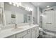 Modern bathroom featuring double sinks, white subway tile shower, and stylish fixtures for a spa-like experience at 9003 Smokey Hill Ln, Fort Mill, SC 29707