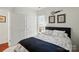 Comfortable bedroom with a full sized bed and two closets, natural light and simple decor at 9003 Smokey Hill Ln, Fort Mill, SC 29707