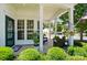 Inviting front porch with seating area, hanging flower baskets, and view of the well-maintained front yard at 9003 Smokey Hill Ln, Fort Mill, SC 29707