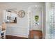 Bright kitchen with white cabinetry, modern appliances, and view of the entryway at 9003 Smokey Hill Ln, Fort Mill, SC 29707