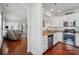 Modern kitchen featuring stainless steel appliances, granite countertops, and rich wood flooring at 9003 Smokey Hill Ln, Fort Mill, SC 29707