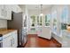 Spacious kitchen with stainless steel appliances and breakfast area with large windows at 9003 Smokey Hill Ln, Fort Mill, SC 29707