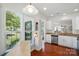 Bright and open kitchen featuring stainless steel appliances and ample natural light from large windows at 9003 Smokey Hill Ln, Fort Mill, SC 29707