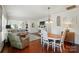 Bright open-concept living room and dining area with hardwood floors and lots of natural light at 9003 Smokey Hill Ln, Fort Mill, SC 29707