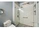 Modern shower with white subway tile, mosaic floor, glass door, and convenient built-in niche at 9003 Smokey Hill Ln, Fort Mill, SC 29707