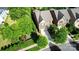 Aerial view of a well-maintained home with lush landscaping and a long driveway at 9735 Wheatfield Rd, Charlotte, NC 28277