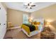 Comfortable bedroom features a ceiling fan and plenty of natural light from the window at 9735 Wheatfield Rd, Charlotte, NC 28277