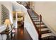 Elegant foyer featuring hardwood floors, a staircase with ornate railings, and neutral paint colors at 9735 Wheatfield Rd, Charlotte, NC 28277