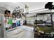 Neat garage featuring a golf cart, organized storage, and bicycles hanging from the ceiling at 9735 Wheatfield Rd, Charlotte, NC 28277
