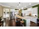 Spacious kitchen with stainless steel appliances, granite countertops, and a central island with seating at 9735 Wheatfield Rd, Charlotte, NC 28277