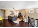 Inviting living area featuring hardwood floors, a ceiling fan, and a comfortable seating arrangement at 9735 Wheatfield Rd, Charlotte, NC 28277