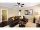 Comfortable living area featuring hardwood floors, ceiling fan, and neutral paint at 9735 Wheatfield Rd, Charlotte, NC 28277