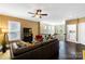 Comfortable living area featuring hardwood floors, ceiling fan, and well-lit windows at 9735 Wheatfield Rd, Charlotte, NC 28277