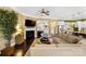Open living room with fireplace and seamless flow into the kitchen, enhancing the space's inviting atmosphere at 9735 Wheatfield Rd, Charlotte, NC 28277