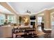 Spacious living room with a ceiling fan, fireplace, and an open layout that flows seamlessly to adjacent spaces at 9735 Wheatfield Rd, Charlotte, NC 28277