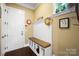 A practical mudroom with bench seating, storage, and a convenient coat rack at 9735 Wheatfield Rd, Charlotte, NC 28277