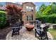 Backyard patio features a fire pit, comfortable seating, and meticulous landscaping at 9735 Wheatfield Rd, Charlotte, NC 28277