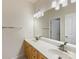 Well-lit bathroom with double sink vanity and large mirror reflecting an open doorway at 9923 Paradise Ridge Rd, Charlotte, NC 28277