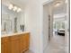 The bathroom features a vanity and a partial view of the main bedroom at 9923 Paradise Ridge Rd, Charlotte, NC 28277