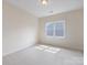 Bedroom featuring neutral carpet with a sunny window at 9923 Paradise Ridge Rd, Charlotte, NC 28277