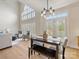 Open concept dining room features large windows, high ceilings, and seamless living room access at 9923 Paradise Ridge Rd, Charlotte, NC 28277