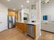 Modern kitchen with stainless steel appliances, quartz countertops, and ample cabinet space at 9923 Paradise Ridge Rd, Charlotte, NC 28277