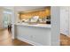 Modern kitchen featuring stainless steel appliances, quartz countertops, and ample cabinet space at 9923 Paradise Ridge Rd, Charlotte, NC 28277