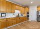 Spacious kitchen featuring stainless steel appliances, ample cabinet space, and a tiled backsplash at 9923 Paradise Ridge Rd, Charlotte, NC 28277