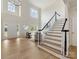 Open living room with high ceilings and a staircase, offering a bright and spacious feel at 9923 Paradise Ridge Rd, Charlotte, NC 28277