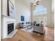 Beautiful living room boasts a fireplace, hardwood floors, and large windows, creating a welcoming space at 9923 Paradise Ridge Rd, Charlotte, NC 28277