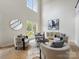 Bright and airy living room with modern furniture, high ceilings, and large windows at 9923 Paradise Ridge Rd, Charlotte, NC 28277