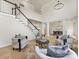 Cozy living room featuring modern furniture, a staircase, and an open floor plan at 9923 Paradise Ridge Rd, Charlotte, NC 28277
