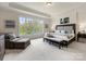 The main bedroom features a large window and neutral decor at 9923 Paradise Ridge Rd, Charlotte, NC 28277