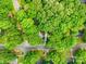 Aerial view of 0.33 acre lot surrounded by mature trees on a quiet street, property line approximations at 10200 Cairnsmore Pl # 9, Mint Hill, NC 28227