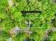 Aerial view of 0.33 acre lot surrounded by mature trees on a quiet street, property line approximations at 10200 Cairnsmore Pl # 9, Mint Hill, NC 28227