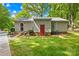 Back of the home featuring a red door, steps to the yard, and an air conditioning unit at 10200 Cairnsmore Pl # 9, Mint Hill, NC 28227