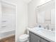 Well-maintained bathroom with a shower-tub combo, modern vanity, and plenty of light at 10200 Cairnsmore Pl # 9, Mint Hill, NC 28227