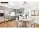 Charming eat-in kitchen featuring gray cabinets, a white countertops, stainless steel appliances, and wood-look floors at 10200 Cairnsmore Pl # 9, Mint Hill, NC 28227